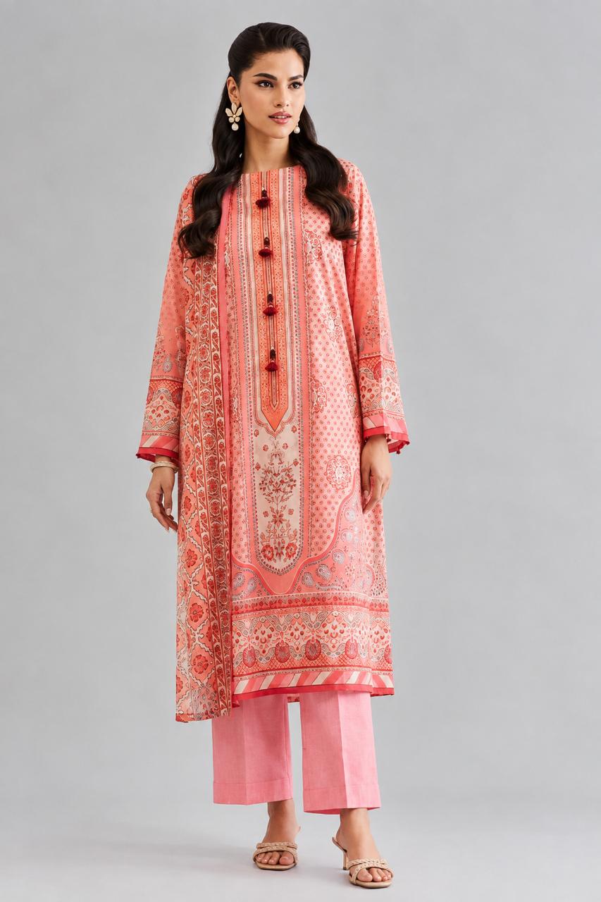 "Woman wearing a 2 piece digital printed suit with matching pink trousers in premium lawn fabric"